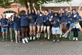 UKirk Student leader jump for joy in group photo to end retreat. 