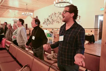  With the help of individual headsets and simultaneous translation in Spanish, French and Korean, participants at the 1001 NWC annual gathering worship together as one body in many languages.