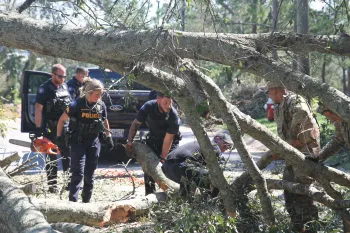 Florida Army National Guard Soldiers and Pensacola Police Department Police Officers conduct joint route clearance operations after the damage made by Hurricane Isaias.