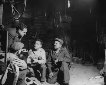 Pastor talking to industrial workers, 1956.