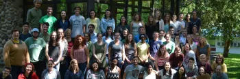 Large group of young adults posing for photo