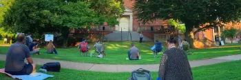 Image of students on a campus during a rally