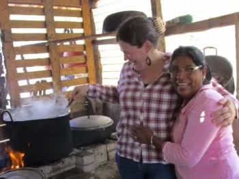 Sarah Henken takes a turn stirring soup with her friend Eunice, one of over 6 million internally displaced persons who are victims of the armed conflict in Colombia. (Photo by Rosaline Maria)