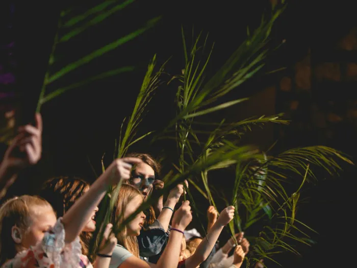 children waving palm branches