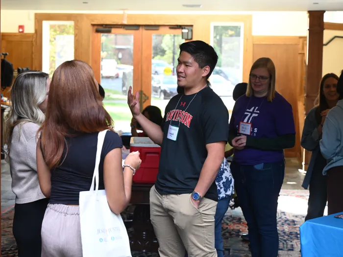 People talking and milling about an open area