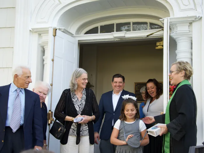 Rev. Dr. Karen Crawford greets Smithtown celebrants