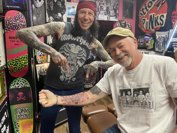 Jeff Eddings shows off Hairy Coo tattoo