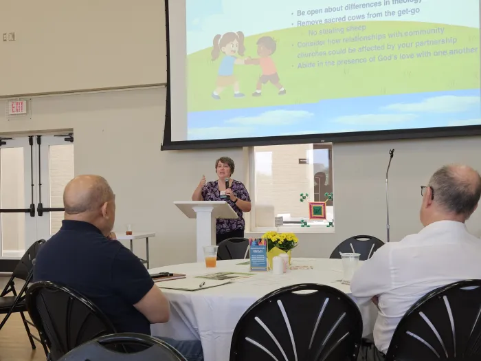 Rev. Sharan Knoell speaks at POAMN by Kelley Hope
