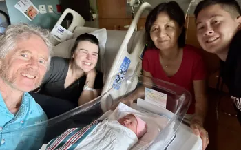 Andrew, MacKenzie, Haeja and Elias in the hospital with the new baby