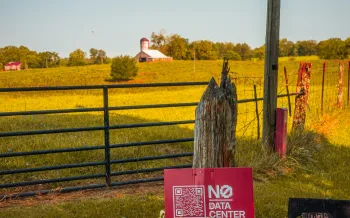 No data centers sign by a large field
