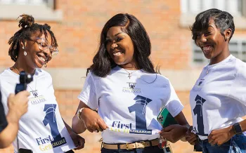 girls on campus showing off t-shirts
