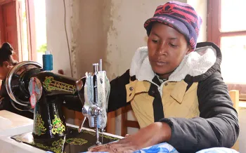 woman using a sewing machine