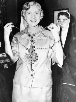 Clare Booth Luce receiving a rosary gift while ambassador to Italy in 1955.