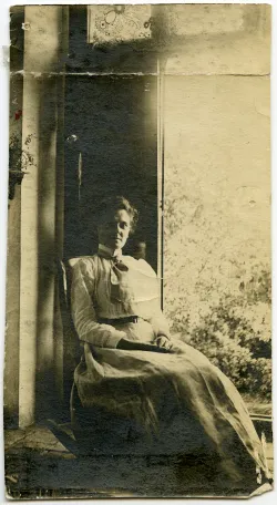 Louise Wilbur Shedd sits by a window.