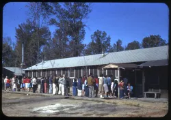 Inmates wait in line at a Japanese American incarceration camp.